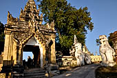 Myanmar - Inwa,  lions guarding enterance to Mahar Aung Mye Bon San Monastery 